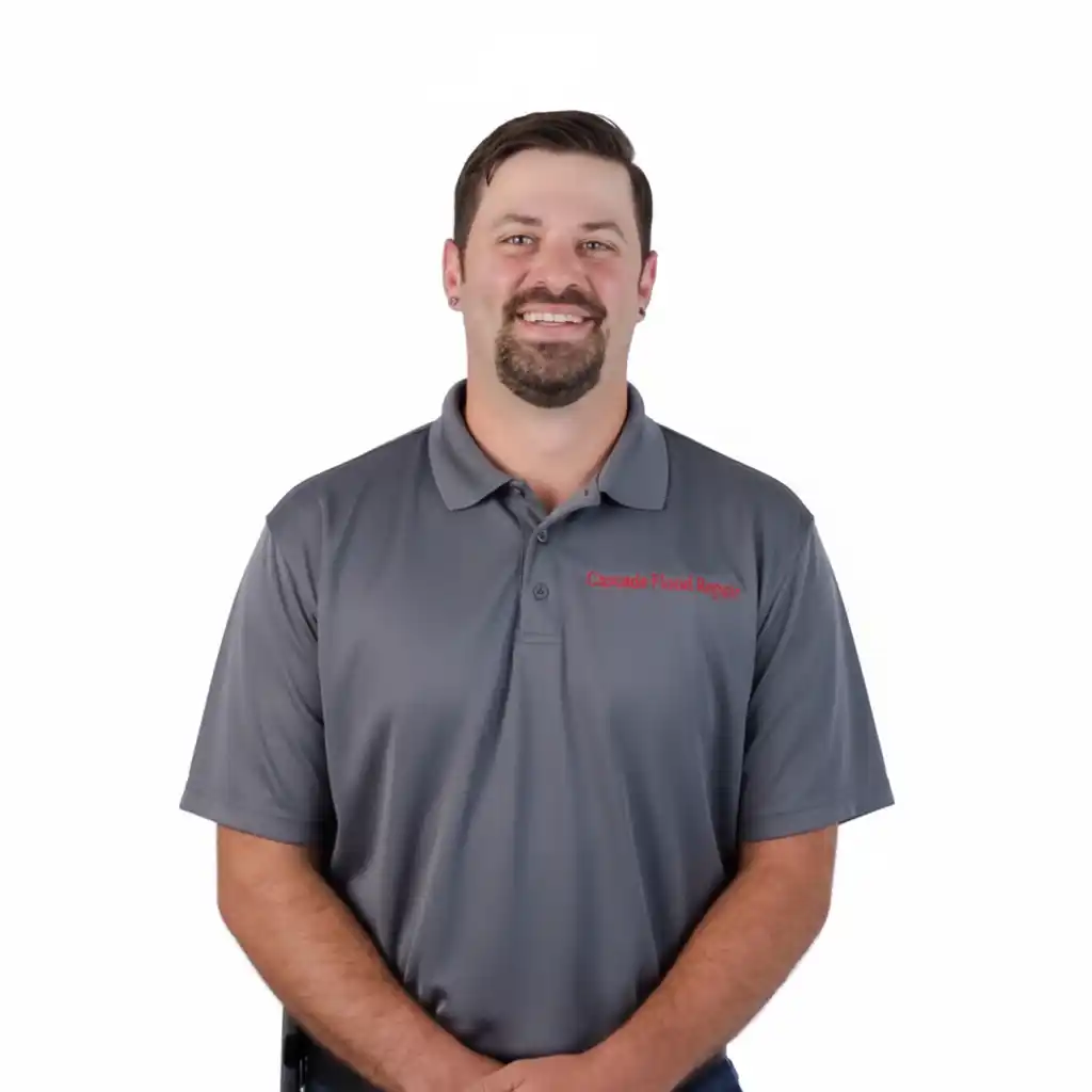 Carl Watson, owner of Cascade Flood Repair, wearing company polo shirt